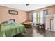 Cozy bedroom features a comfortable armchair and ample natural light at 995 Chimney Trace Way, Lawrenceville, GA 30045