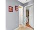 Neutral-colored hallway with white trim and doors offers access to other rooms at 995 Chimney Trace Way, Lawrenceville, GA 30045