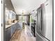 Well-equipped kitchen features stainless steel appliances, granite countertops, and ample cabinet space at 995 Chimney Trace Way, Lawrenceville, GA 30045