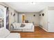 Bright living room with laminate floors, neutral walls, and a comfortable sectional sofa at 995 Chimney Trace Way, Lawrenceville, GA 30045