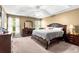 Spacious bedroom with tray ceiling, neutral decor, and large windows offering great natural light at 995 Chimney Trace Way, Lawrenceville, GA 30045