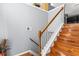 Wooden staircase with white railing complements the home's interior design at 995 Chimney Trace Way, Lawrenceville, GA 30045