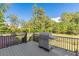 This backyard deck features a stainless steel outdoor grill and lovely landscaping at 270 Annelise Park Dr, Fayetteville, GA 30214