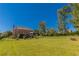 Expansive backyard with lush green grass and mature trees backing up to home at 270 Annelise Park Dr, Fayetteville, GA 30214