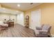 Versatile basement space with wood floors, seating area, and storage closets provides flexible living and organization at 270 Annelise Park Dr, Fayetteville, GA 30214