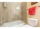 Shower with tan tile and glass doors at 270 Annelise Park Dr, Fayetteville, GA 30214