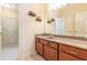 Bathroom featuring a vanity with storage, a large mirror, and baseball glove decor at 270 Annelise Park Dr, Fayetteville, GA 30214