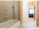 Clean bathroom with glass enclosed tub and tiled shower at 270 Annelise Park Dr, Fayetteville, GA 30214