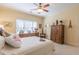 Comfortable bedroom with neutral walls, decorative accents, ceiling fan and plenty of natural light at 270 Annelise Park Dr, Fayetteville, GA 30214