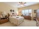 Inviting bedroom with neutral decor, soft lighting, and comfortable furnishings at 270 Annelise Park Dr, Fayetteville, GA 30214