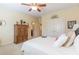 Comfortable bedroom with neutral walls, decorative accents, ceiling fan and plenty of natural light at 270 Annelise Park Dr, Fayetteville, GA 30214