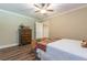 Bright bedroom with hardwood floors, classic chest of drawers, and a whimsical table at 270 Annelise Park Dr, Fayetteville, GA 30214