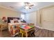 bedroom with a colorful quilt, twin beds, and hardwood flooring at 270 Annelise Park Dr, Fayetteville, GA 30214