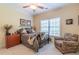 Charming bedroom with a ceiling fan, reading chair, and coordinating decor at 270 Annelise Park Dr, Fayetteville, GA 30214