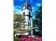 Clock tower with colorful azaleas and trees at 270 Annelise Park Dr, Fayetteville, GA 30214