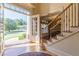 Grand foyer featuring hardwood floors and staircase with iron spindles at 270 Annelise Park Dr, Fayetteville, GA 30214