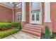 Close up view of brick porch with double door entry and white pillars at 270 Annelise Park Dr, Fayetteville, GA 30214