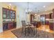 The kitchen and breakfast area features granite countertops, wooden floors, and wine storage at 270 Annelise Park Dr, Fayetteville, GA 30214