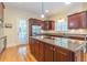 Gourmet kitchen with granite countertops, stainless steel appliances, and custom wood cabinetry at 270 Annelise Park Dr, Fayetteville, GA 30214