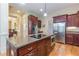 Well-appointed kitchen featuring a large island, stainless steel appliances, and custom cabinetry at 270 Annelise Park Dr, Fayetteville, GA 30214