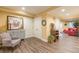 Inviting living room area features a comfy chair, closet doors, and stylish decor creating a welcoming atmosphere at 270 Annelise Park Dr, Fayetteville, GA 30214