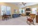 Sun-lit living room features a brick fireplace and bright windows at 270 Annelise Park Dr, Fayetteville, GA 30214