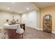 Comfortable home office space with plush seating, wood-look floors, and ample storage at 270 Annelise Park Dr, Fayetteville, GA 30214
