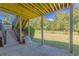 Covered patio with stairs leading to a fenced backyard and views of lush greenery at 270 Annelise Park Dr, Fayetteville, GA 30214