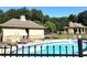 Inviting community pool area with lounge chairs, pool house, and lush greenery provides a relaxing outdoor space at 270 Annelise Park Dr, Fayetteville, GA 30214