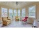 Bright sunroom with tiled floors, multiple windows, and comfortable seating at 270 Annelise Park Dr, Fayetteville, GA 30214
