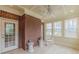 Bright sunroom with tiled floor, rocking chair and lots of natural light at 270 Annelise Park Dr, Fayetteville, GA 30214