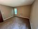 Cozy bedroom with carpet, freshly painted walls, and natural light at 2705 Rhoanoke Dr, Duluth, GA 30096