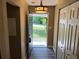 Welcoming entryway with wood-look floors, closet, and a view to the outdoors at 2705 Rhoanoke Dr, Duluth, GA 30096