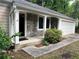 The house features a front entrance with stone accents and a white two-car garage at 2705 Rhoanoke Dr, Duluth, GA 30096