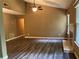 Large living room with sloped ceiling, fireplace, windows, and patio door at 2705 Rhoanoke Dr, Duluth, GA 30096