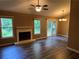 Bright living area with fireplace, new flooring, ceiling fan, and sliding doors to deck at 2705 Rhoanoke Dr, Duluth, GA 30096