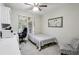 Functional bedroom with a desk, chair, and a twin bed at 3250 Seven Oaks Dr, Cumming, GA 30041