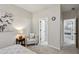 Bedroom featuring sitting area, ensuite bathroom and view to additional bedroom at 3250 Seven Oaks Dr, Cumming, GA 30041