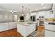 Spacious kitchen with stainless steel appliances, island, and hardwood floors at 3250 Seven Oaks Dr, Cumming, GA 30041
