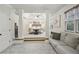 Bright main bedroom with tray ceilings, sitting area, and large windows at 3250 Seven Oaks Dr, Cumming, GA 30041
