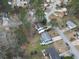 Aerial view of a neighborhood showcasing neatly arranged homes with well-manicured lawns and mature trees at 4608 Rosemear Ct, Norcross, GA 30093