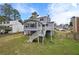 Exterior of home with nice sized backyard, deck and door leading inside at 4608 Rosemear Ct, Norcross, GA 30093