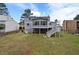 Exterior of home with nice sized backyard, deck and door leading inside at 4608 Rosemear Ct, Norcross, GA 30093