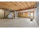 Unfinished basement with exposed wooden ceiling and concrete floors at 4608 Rosemear Ct, Norcross, GA 30093