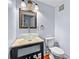 Chic powder room with a vessel sink, modern fixtures, and elegant decor at 4608 Rosemear Ct, Norcross, GA 30093