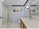 Modern bathroom with a walk-in shower and neutral color palette at 4608 Rosemear Ct, Norcross, GA 30093