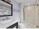 Bathroom with a glass shower, modern vanity, and updated fixtures at 4608 Rosemear Ct, Norcross, GA 30093