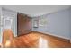 The bedroom features hardwood floors, neutral paint, and a window at 4608 Rosemear Ct, Norcross, GA 30093