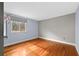 Bedroom featuring hardwood floors, neutral paint, and a window for natural light at 4608 Rosemear Ct, Norcross, GA 30093