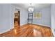 Dining room featuring hardwood floors, chandelier, and easy access to the kitchen at 4608 Rosemear Ct, Norcross, GA 30093